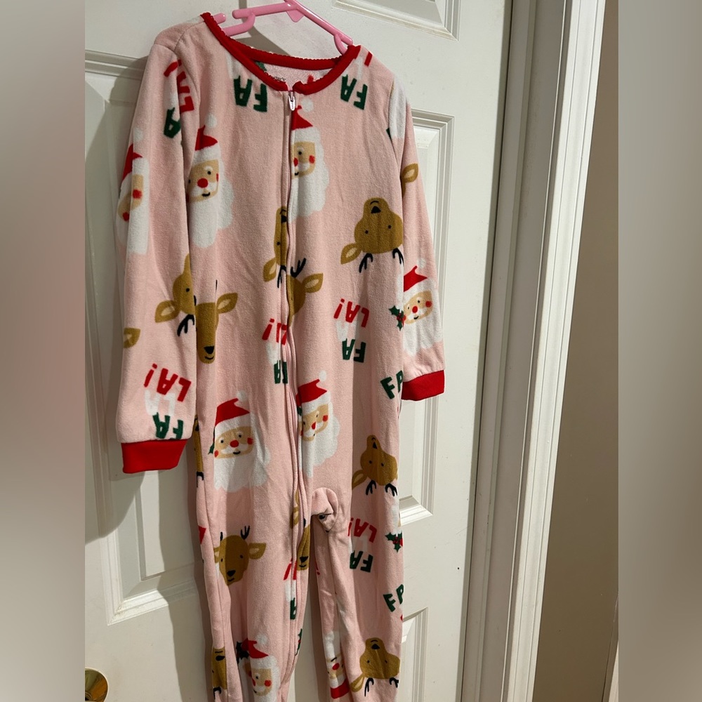 Carters holiday pajamas. Size 6. Pink with Santa Claus and reindeers.